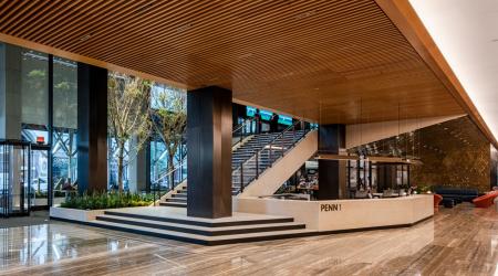 The PENN 1 lobby stairs connect the main entrance to tenant amenities on levels two and three.